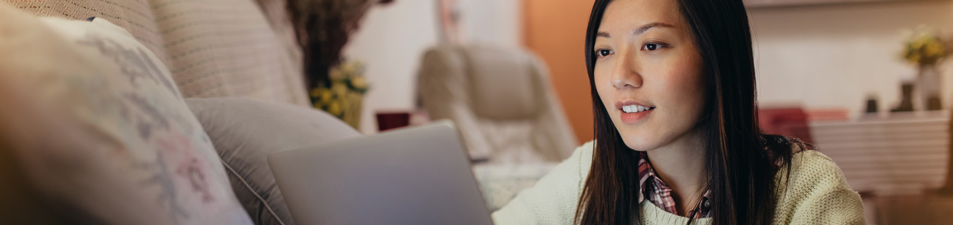 Woman at computer looking at health insurance options